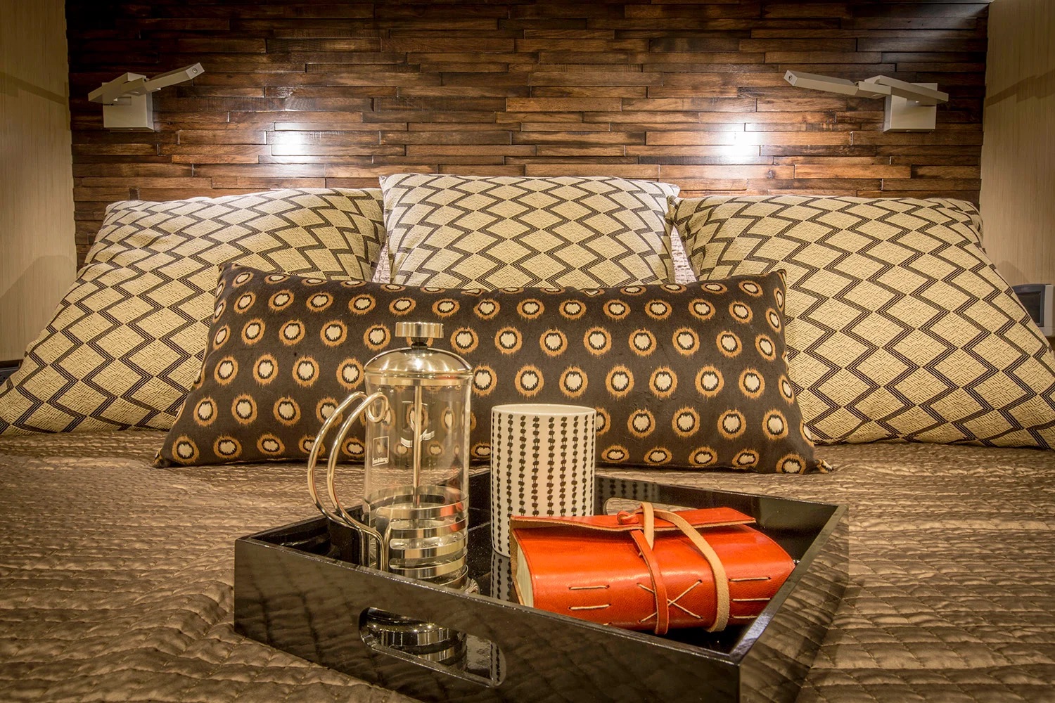 Coffee tray and pillows on bed